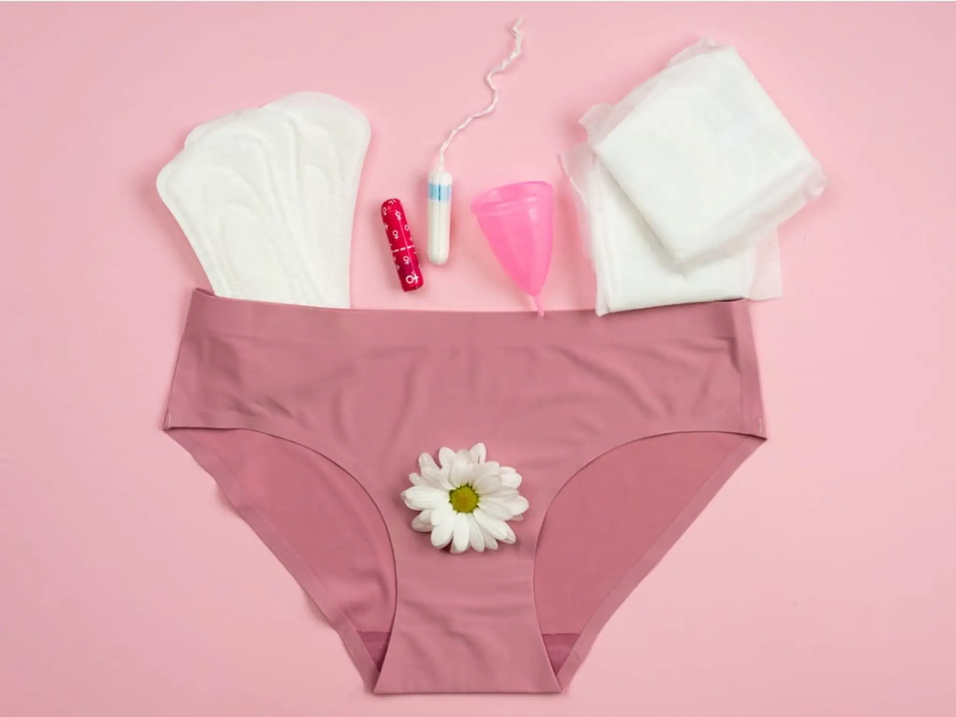 underwear surrounded by period products
