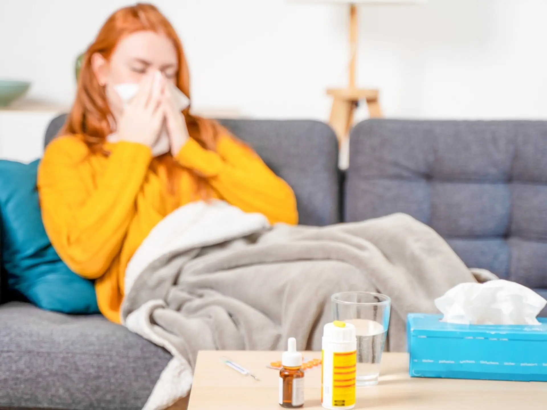 woman blowing her nose