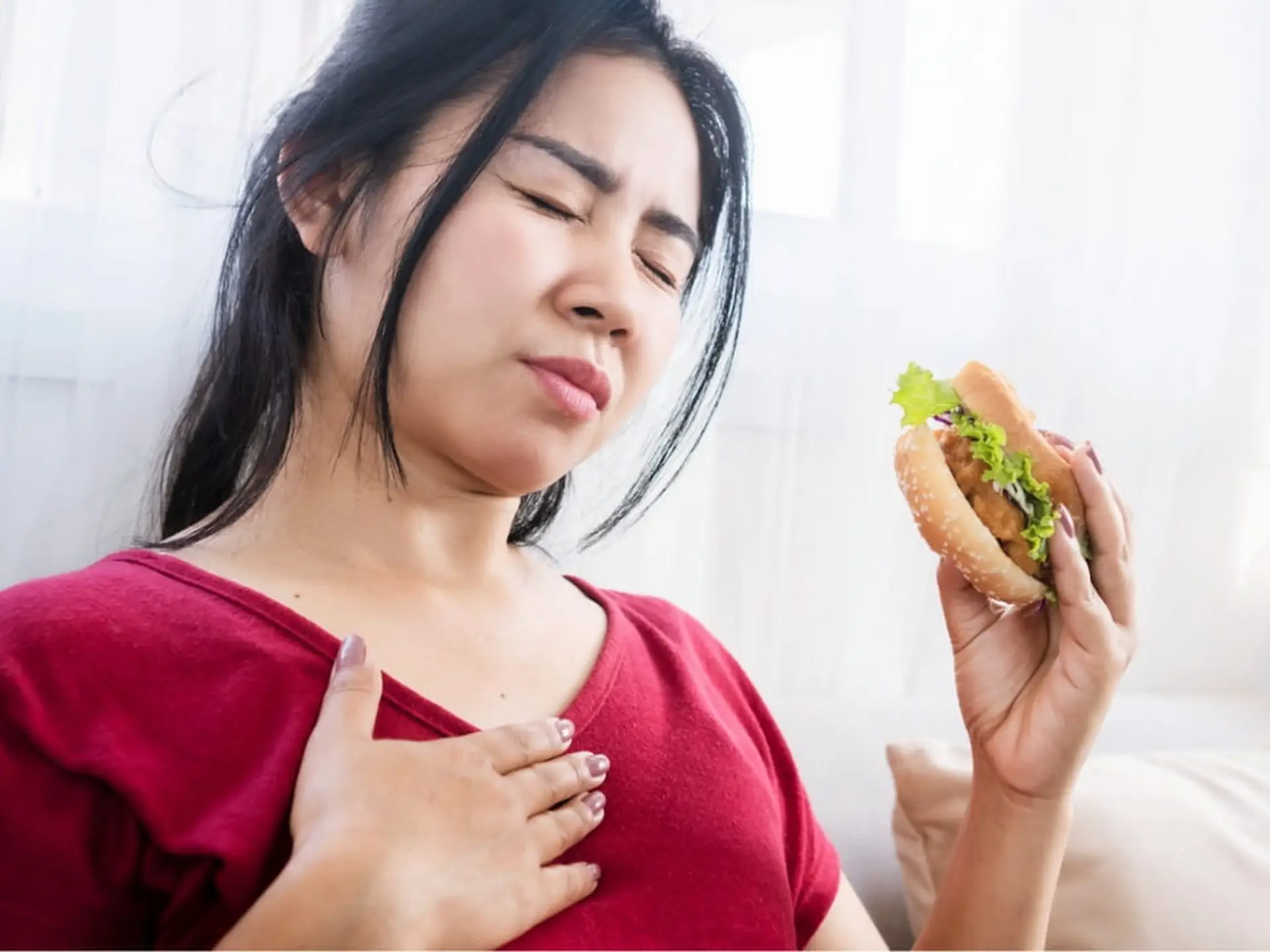 woman having heartburn