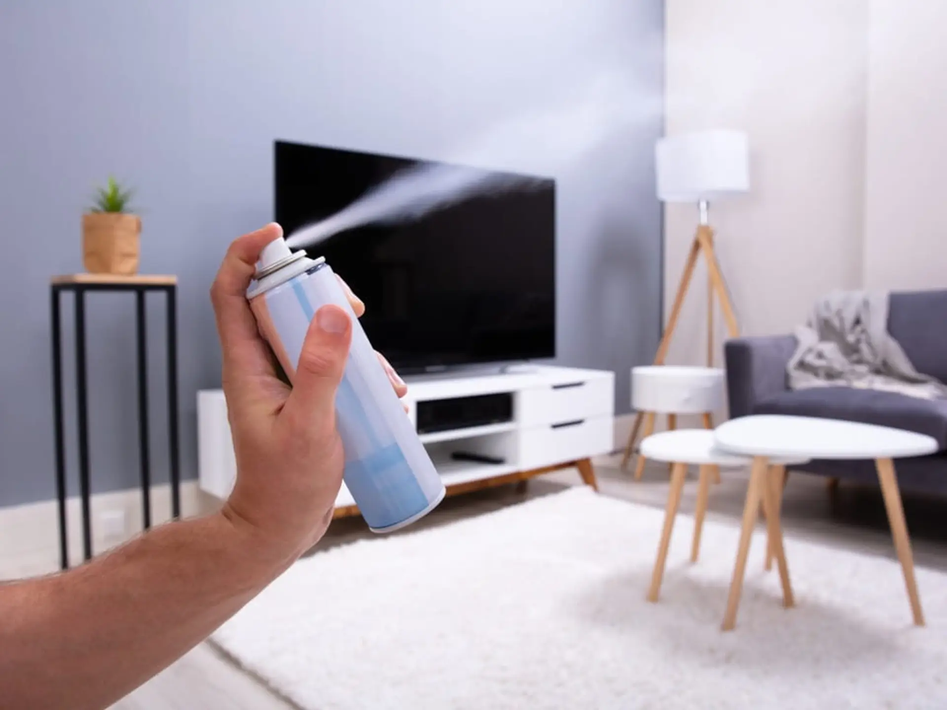 air freshener spraying in living room