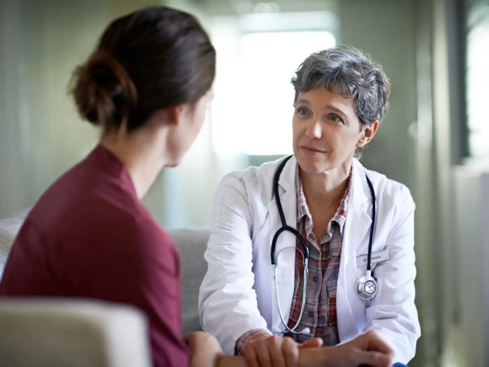 woman talking to doctor