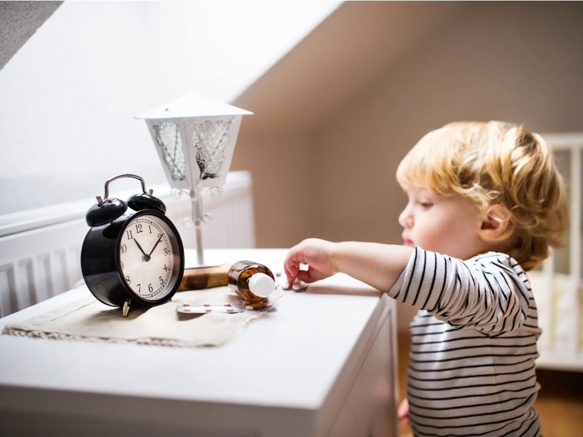 toddler reaching for medication
