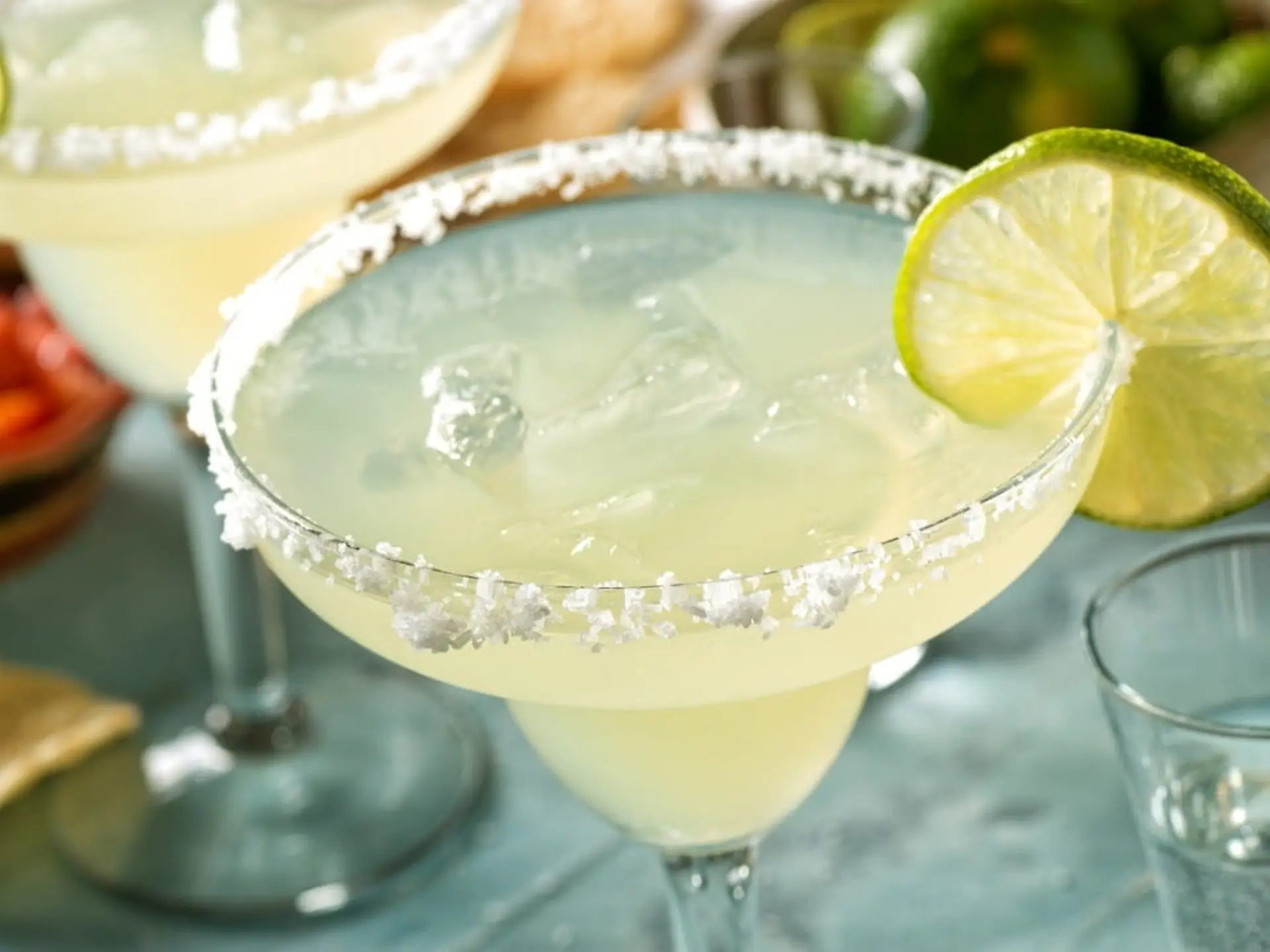 margarita with lime on outdoor table