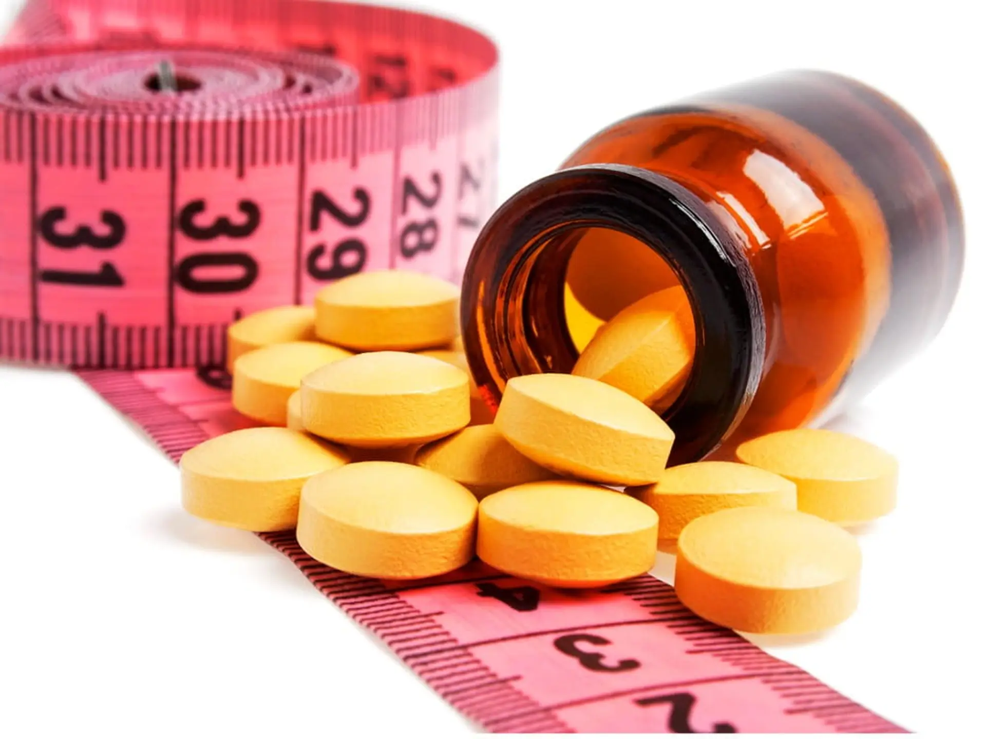 diet pills and measuring tape