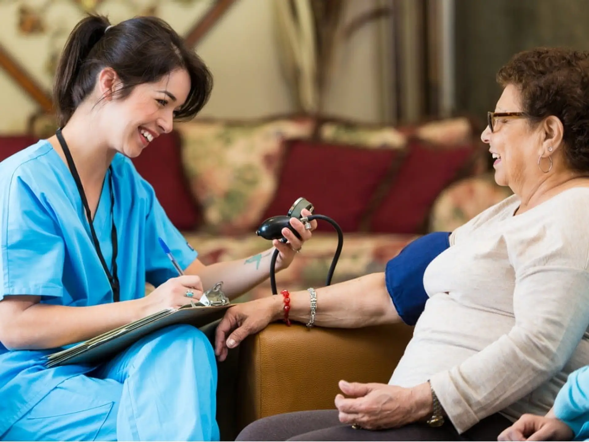 nurse checking patient's blood pressure