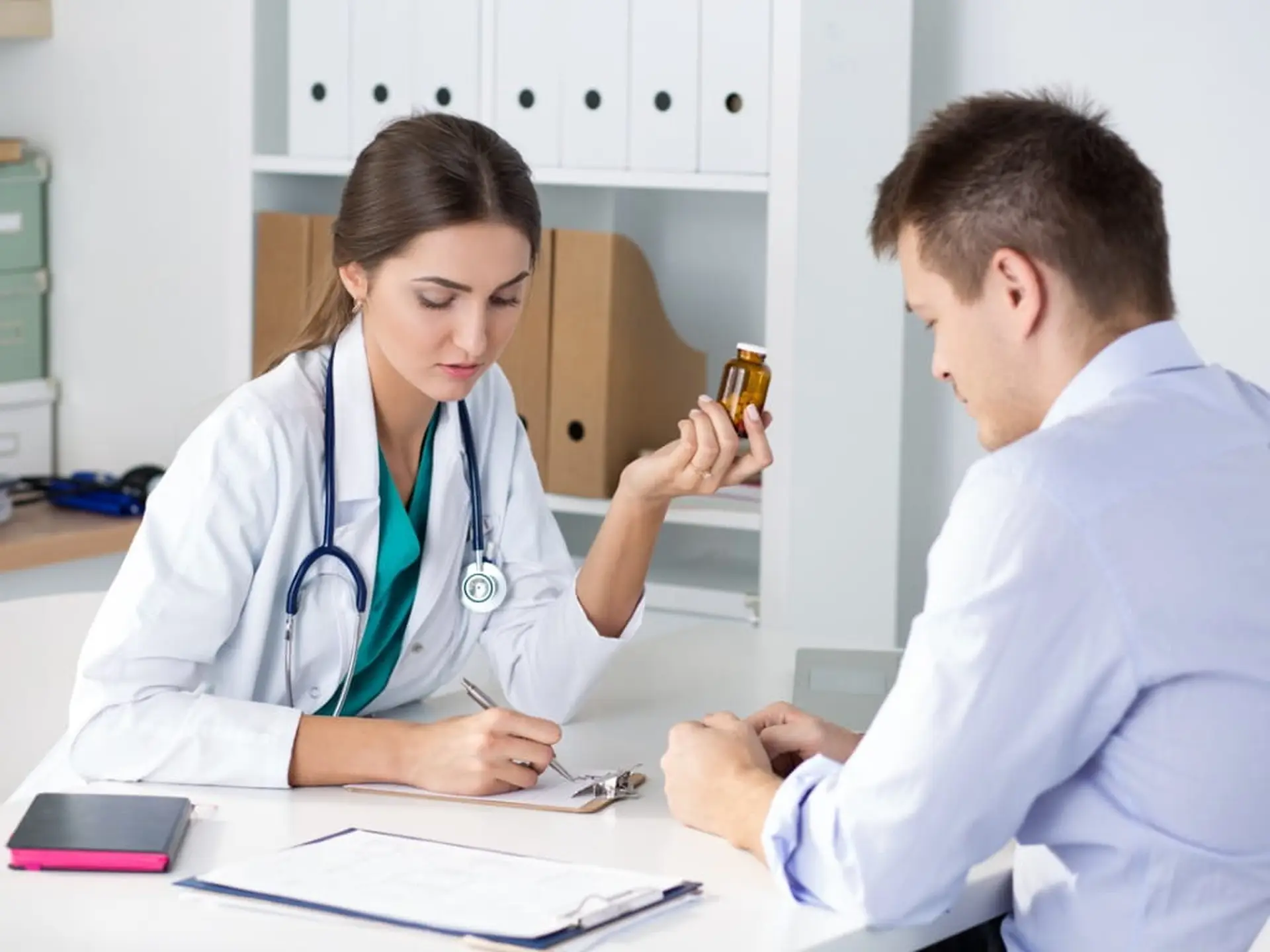 doctor prescribing medication to her patient