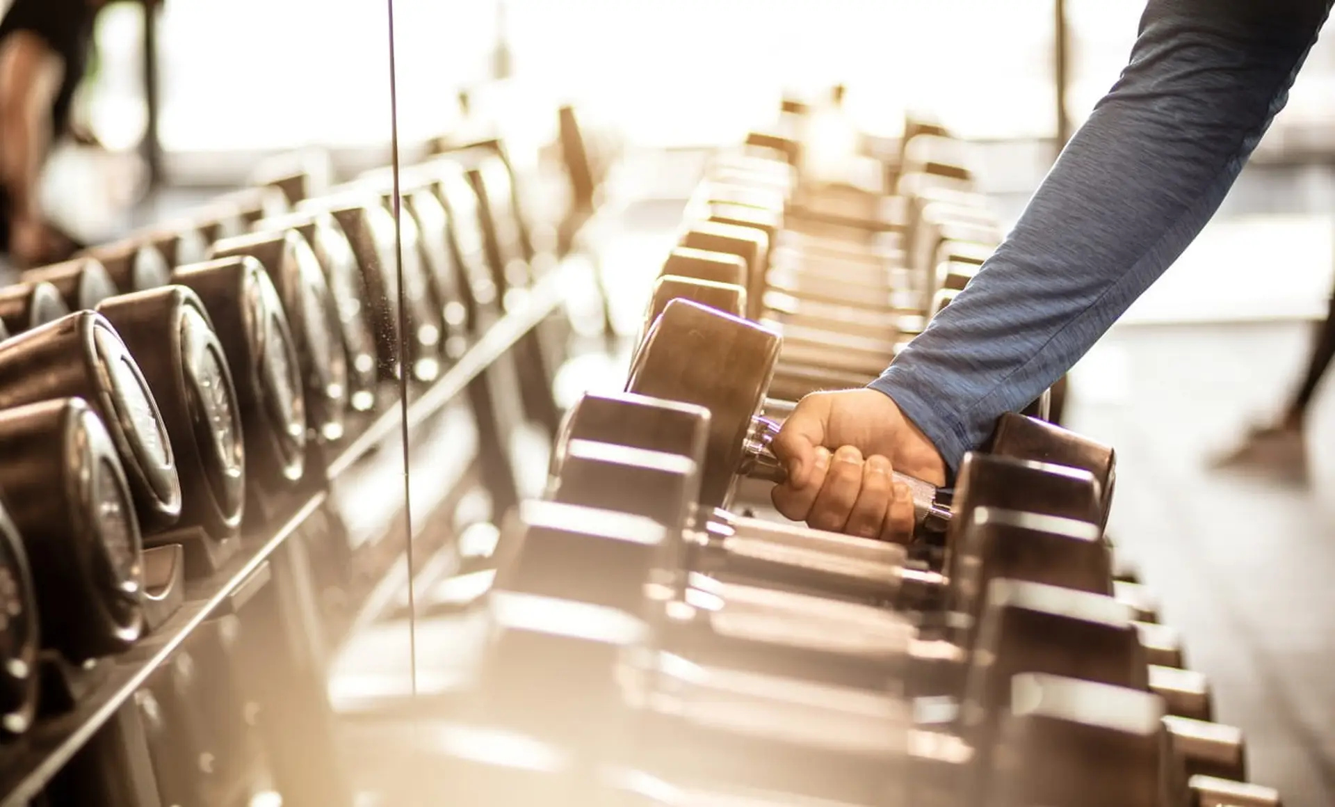 man picking up weight