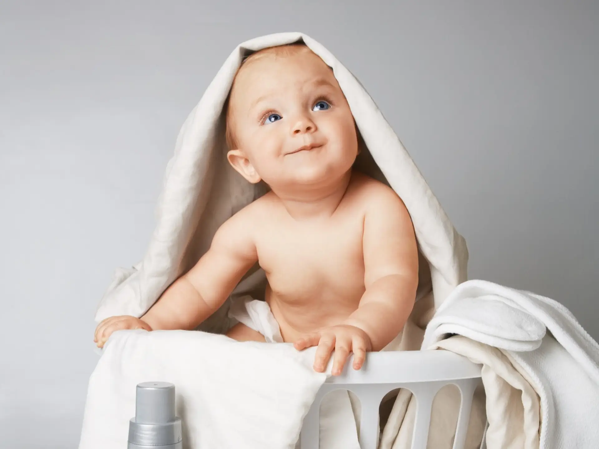 baby in laundry basket