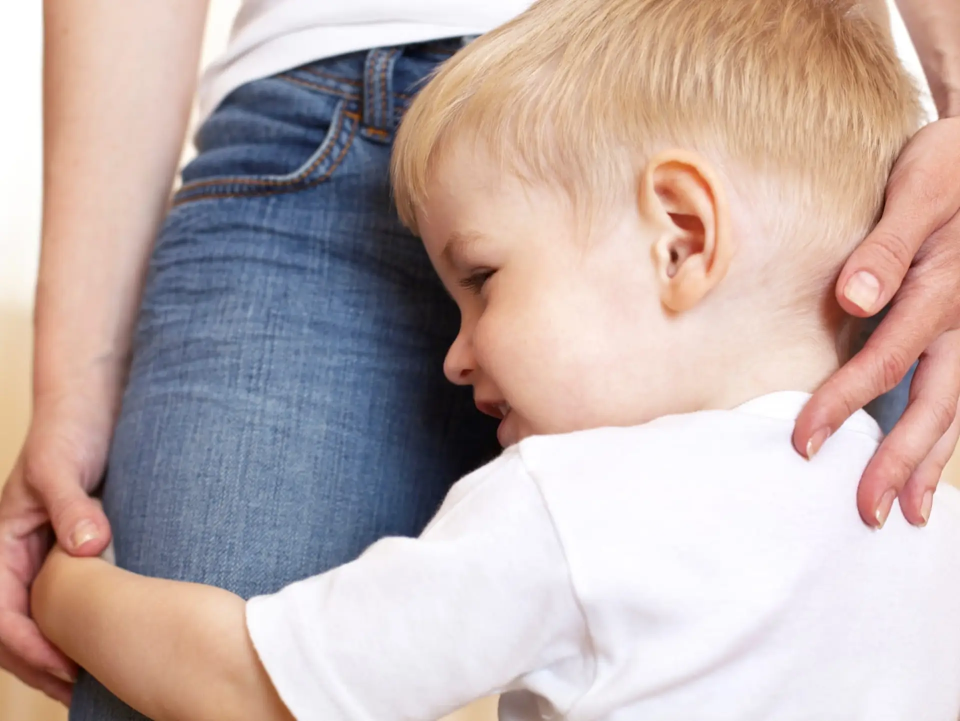 child hugging mother