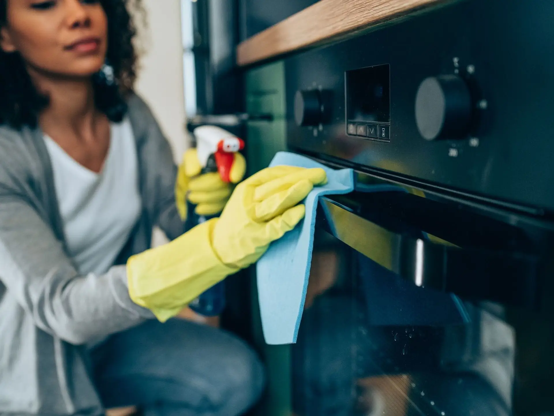woman cleaning kitchen