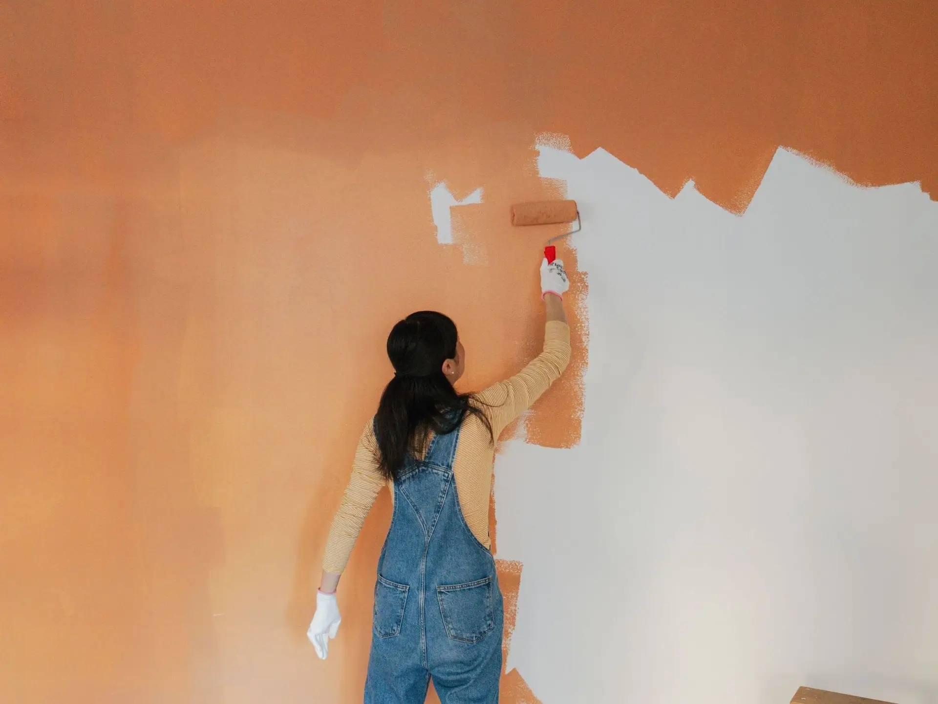 woman painting wall