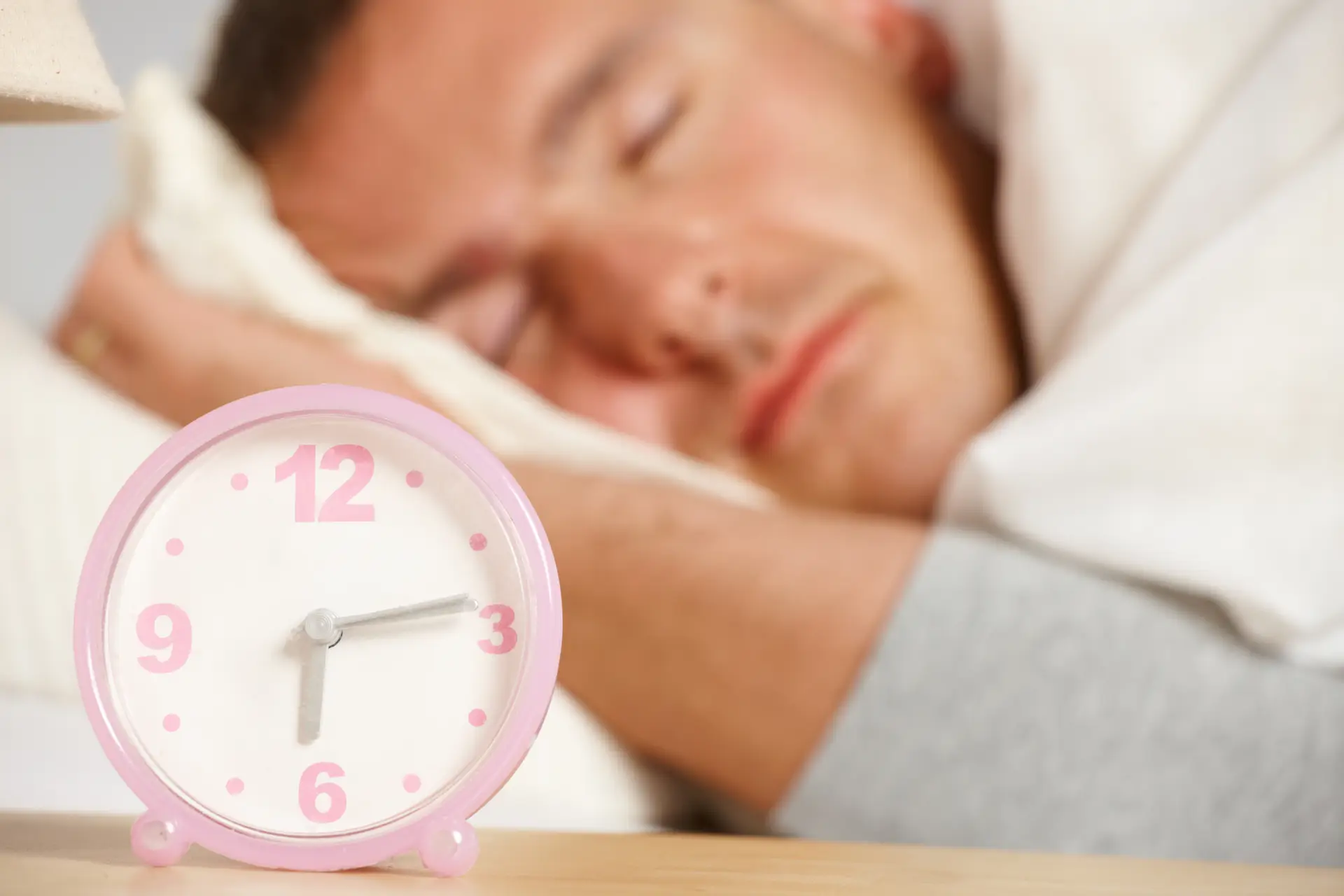 clock and sleeping man