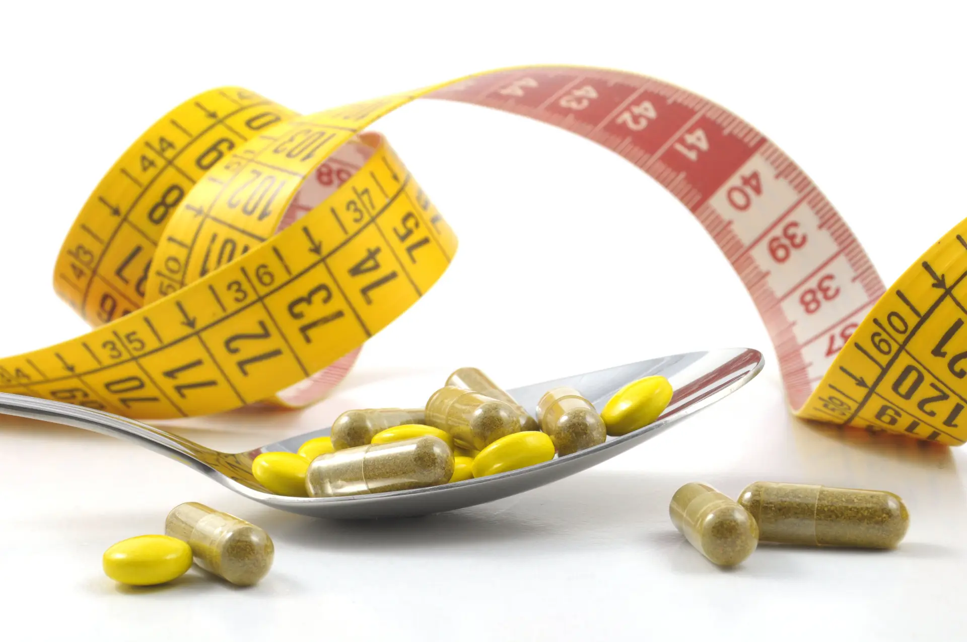 weight loss supplements and tape measure