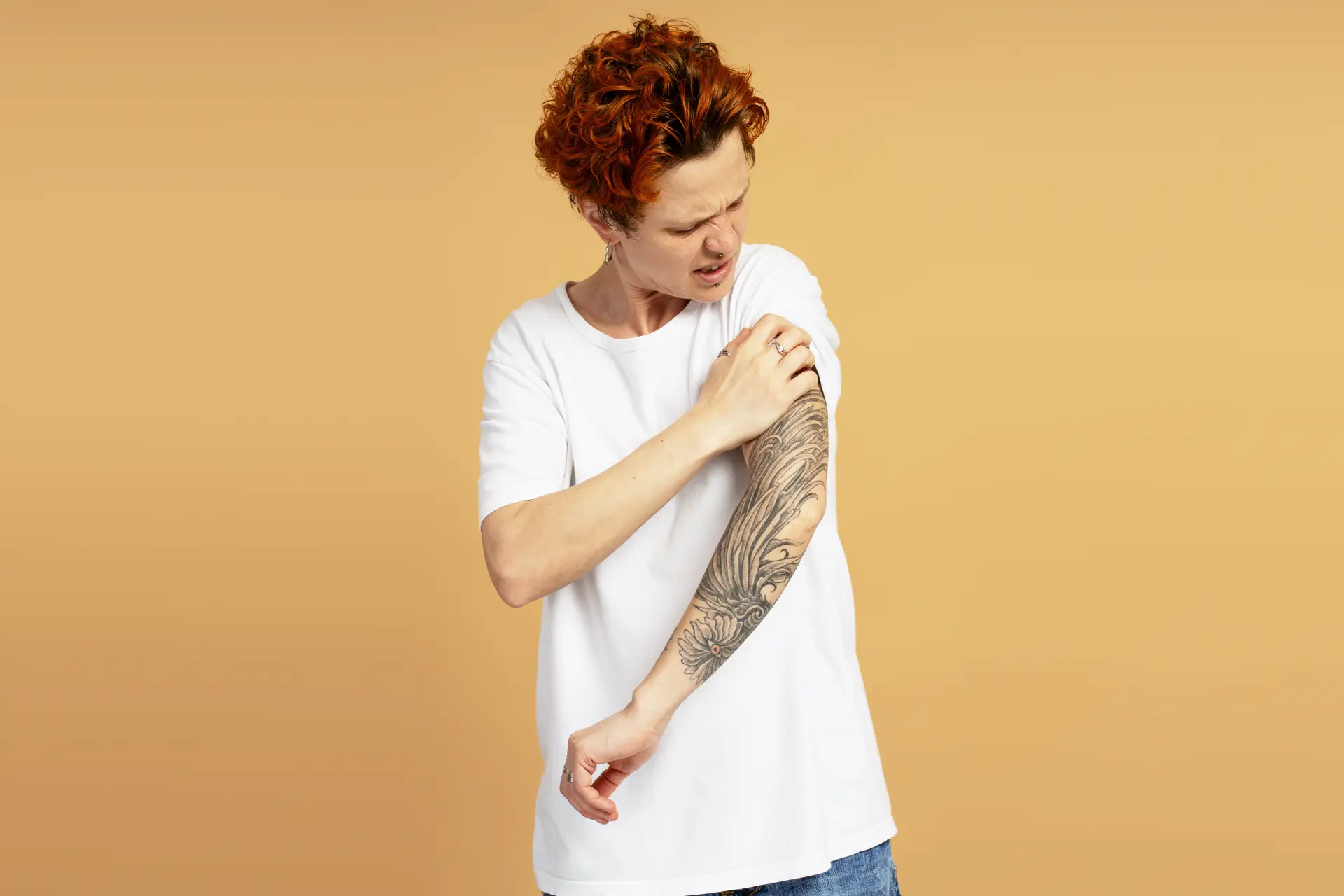 Person itching tattoo