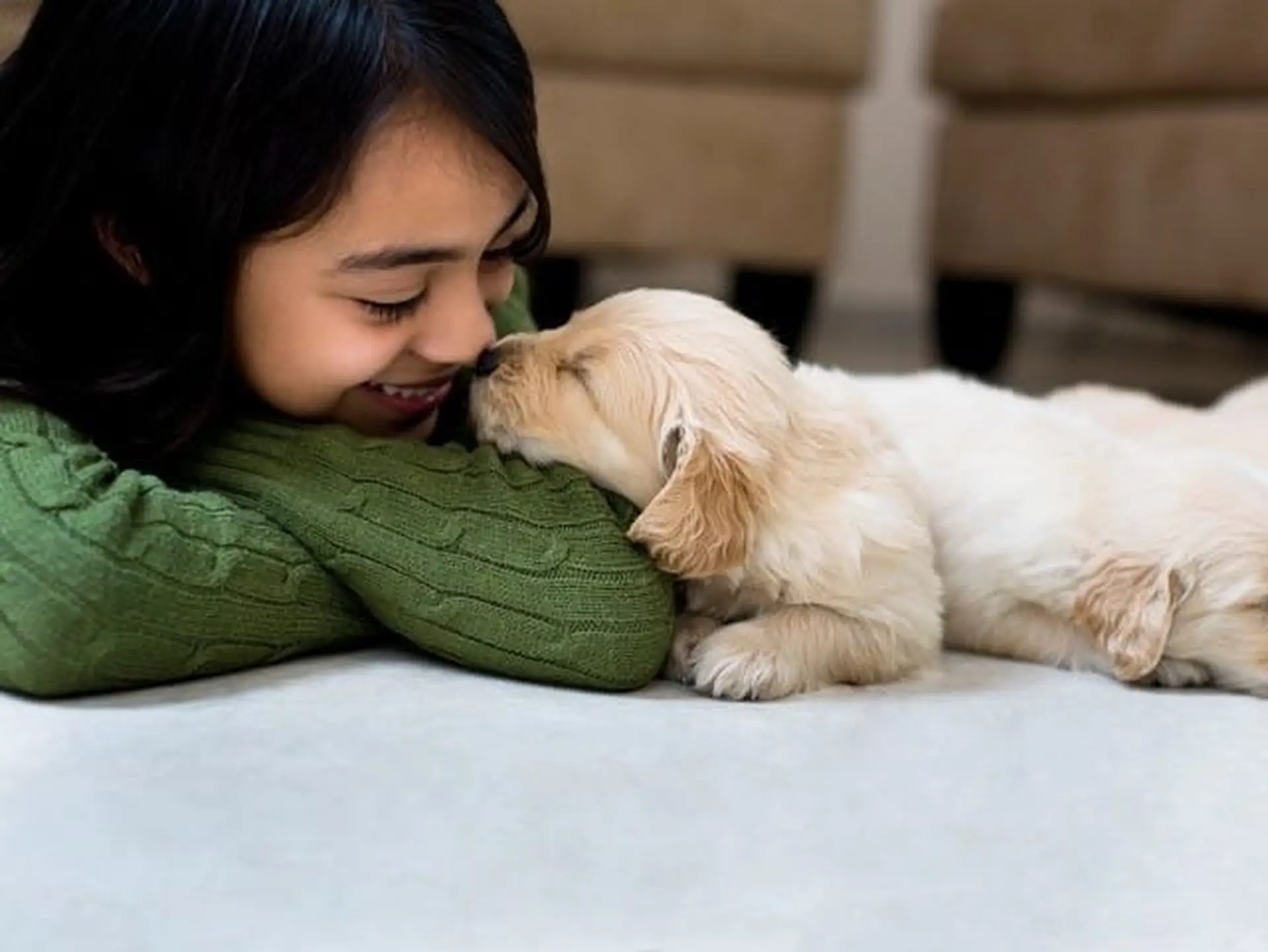 Girl playing with puppy