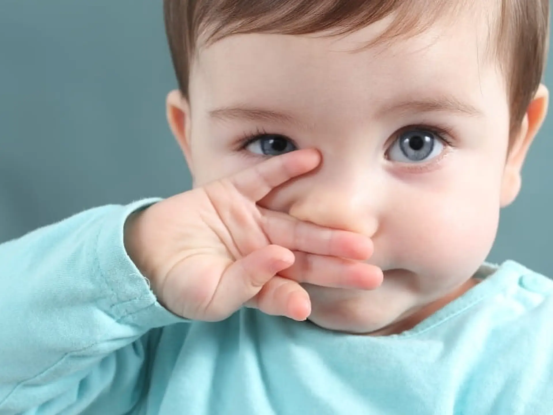 toddler wiping nose