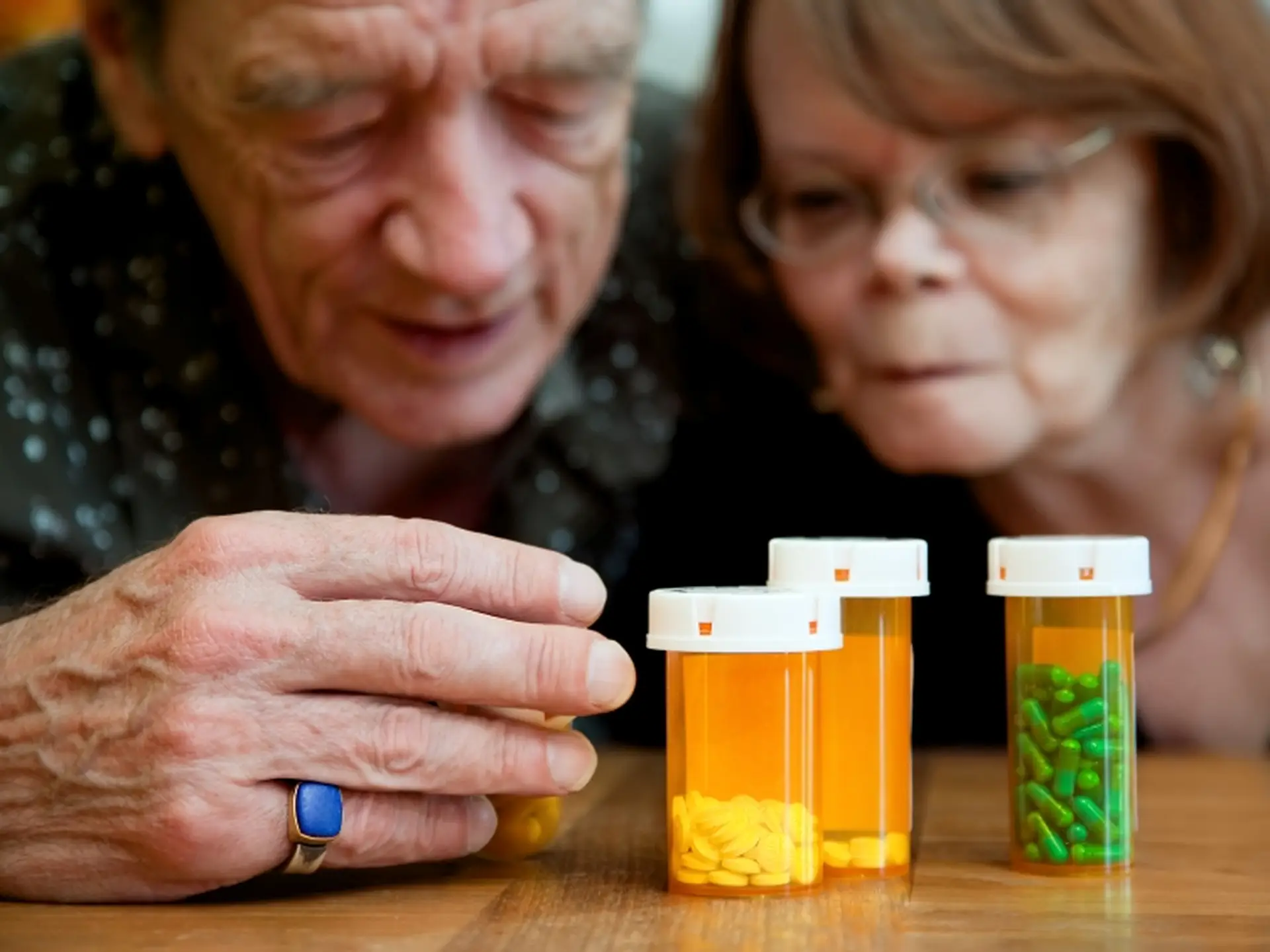 couple looking at medicines