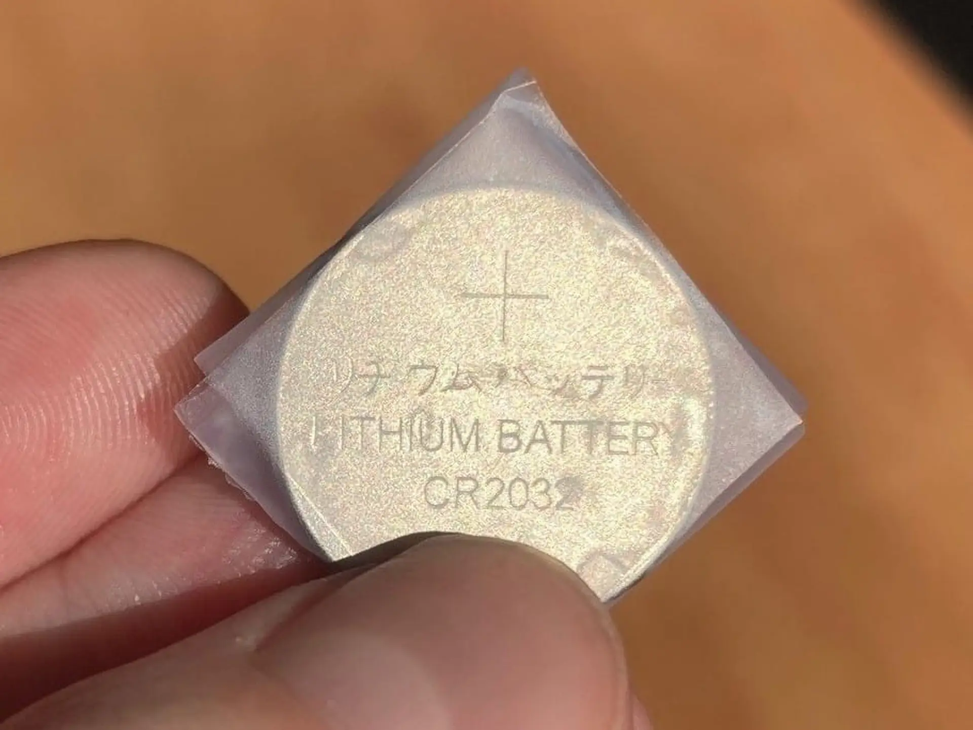taped button battery