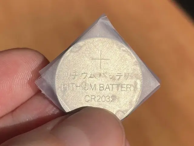 taped button battery